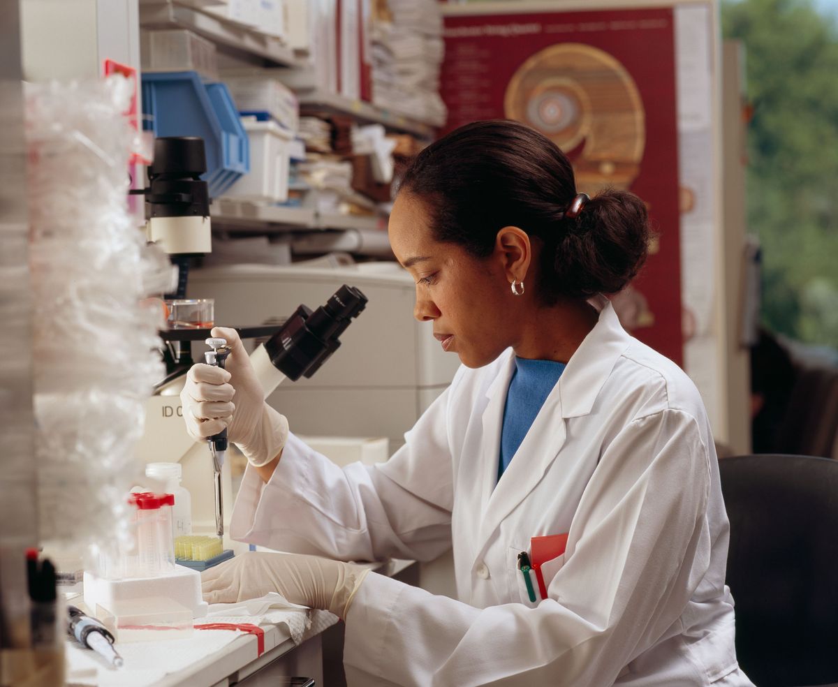 National Institutes of Health researcher working at a laboratory bench